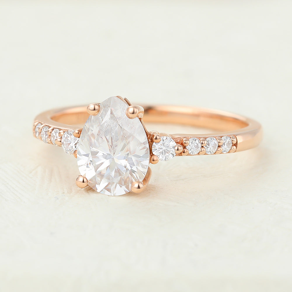 1 CT Pear Shaped Moissanite Engagement Ring In Three Stone Design