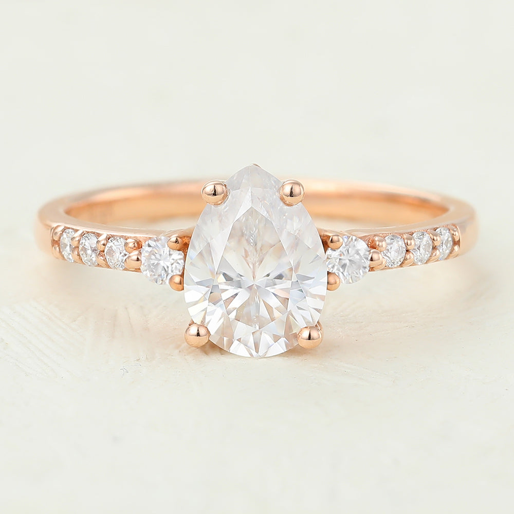 1 CT Pear Shaped Moissanite Engagement Ring In Three Stone Design