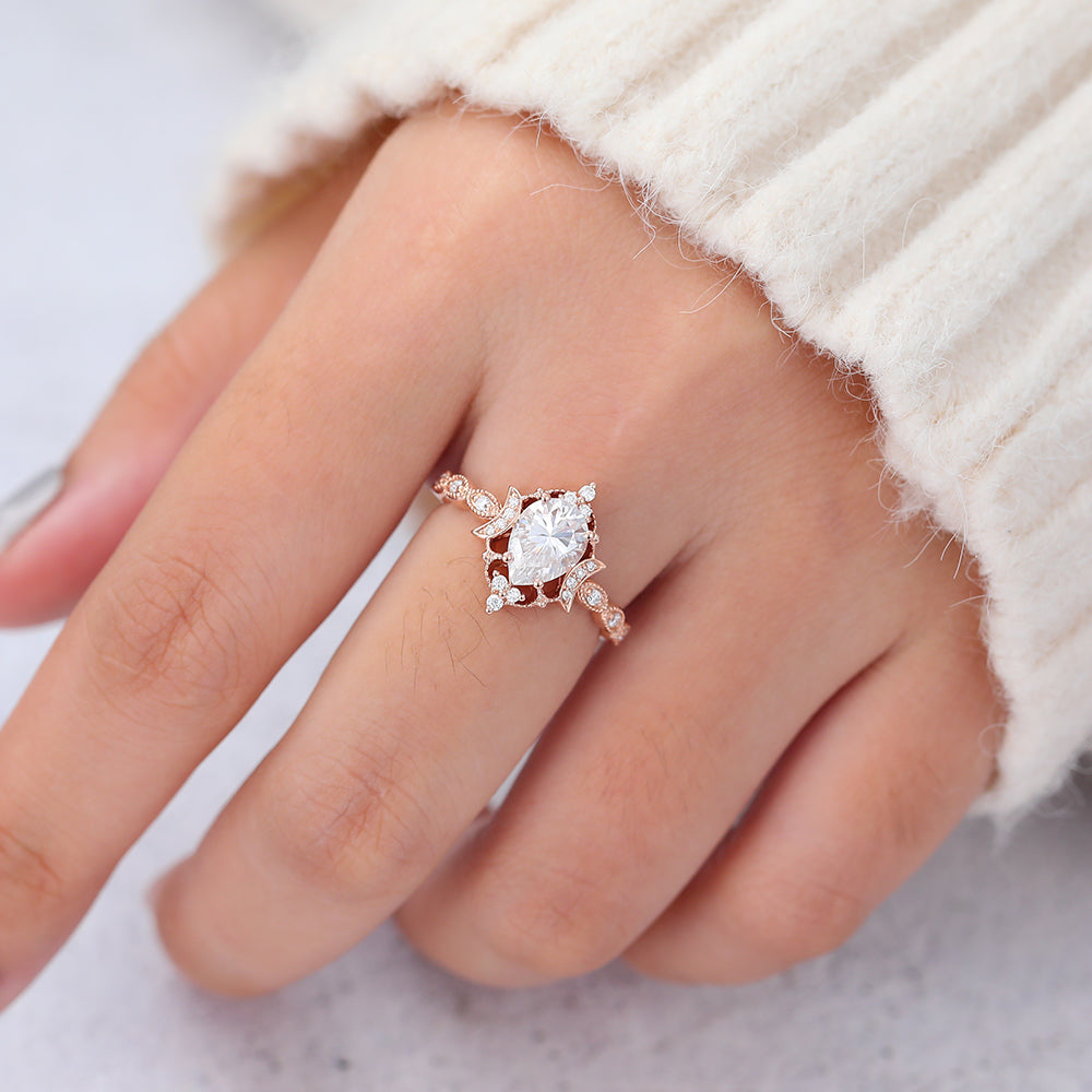 0.9 CT Pear Shaped Moissanite Engagement Ring In Cluster Design