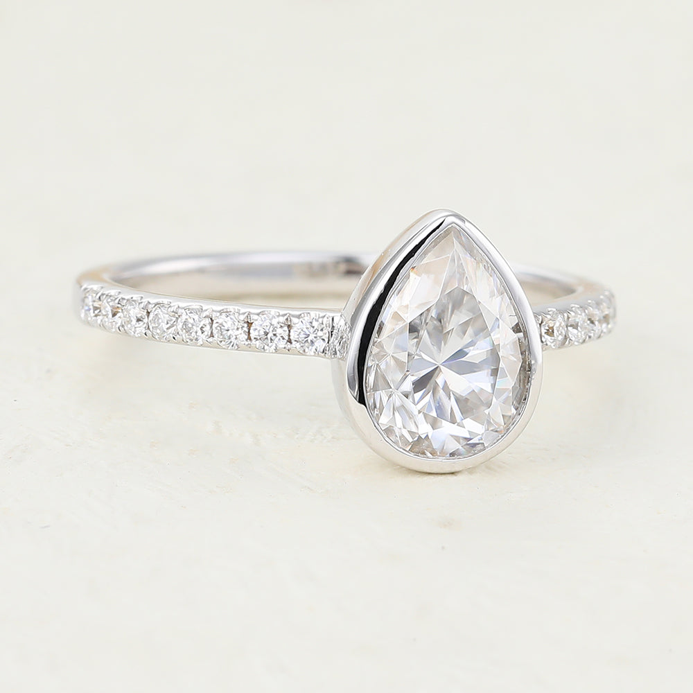 1 CT Pear Shaped Moissanite Engagement Ring In Pave Design