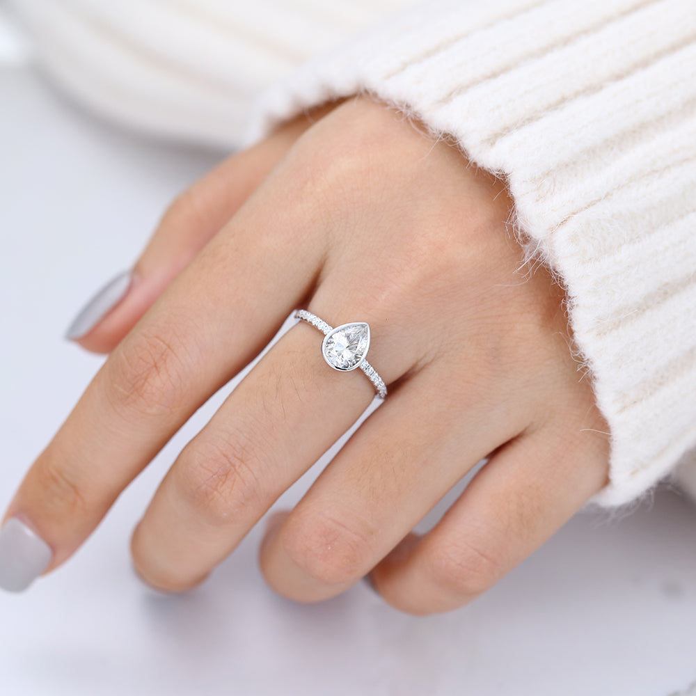 1 CT Pear Shaped Moissanite Engagement Ring In Pave Design