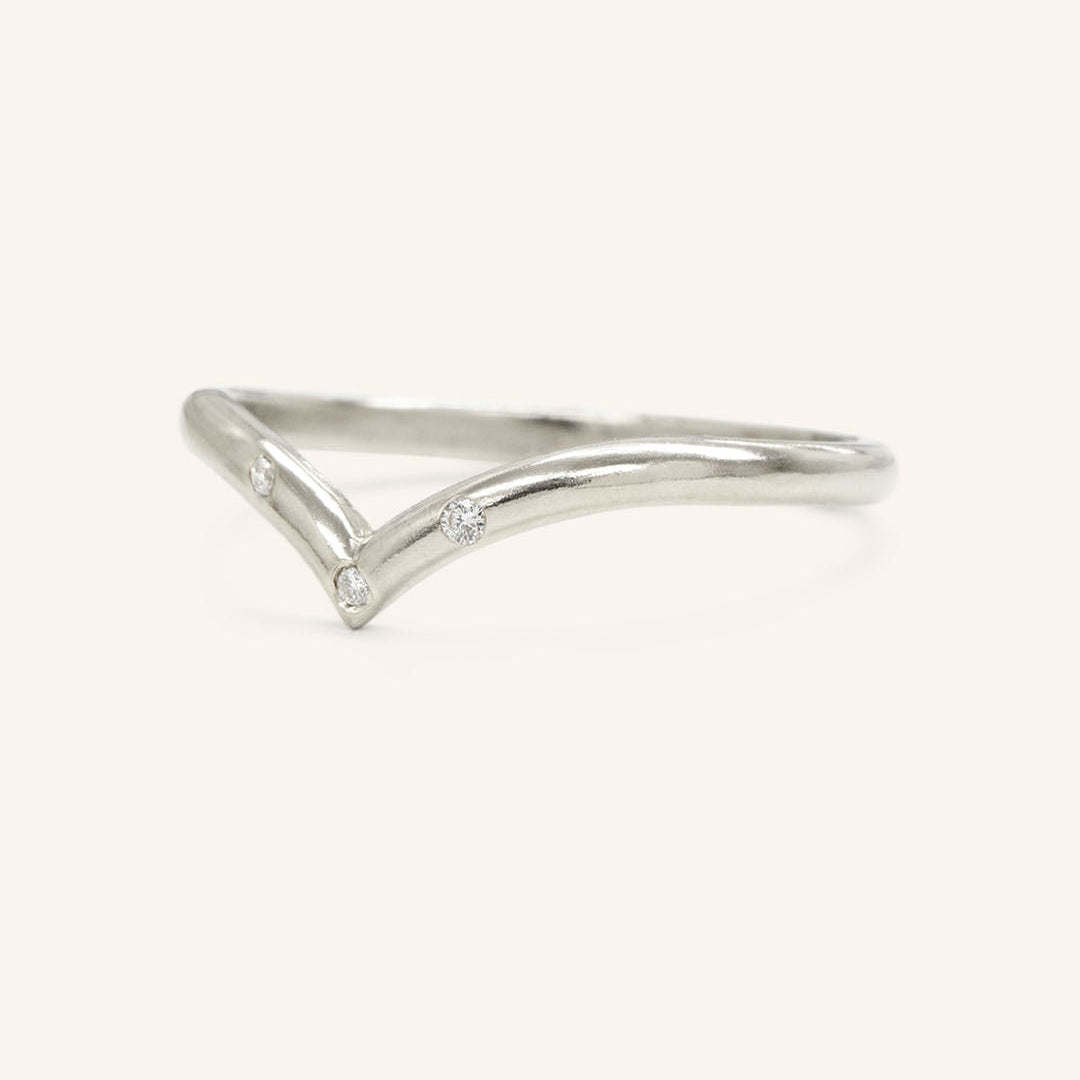 0.023 TCW Round Curved Moissanite Wedding Band