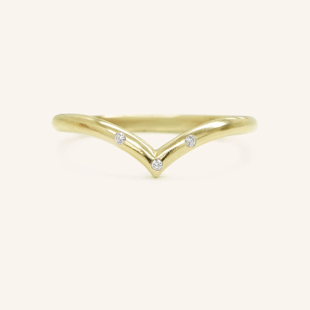 0.023 TCW Round Curved Moissanite Wedding Band