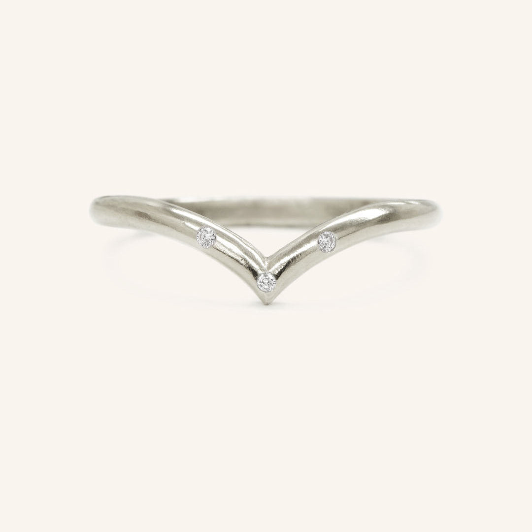 0.023 TCW Round Curved Moissanite Wedding Band