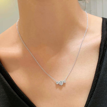 1.4 TCW Round Moissanite Three Stone Necklace
