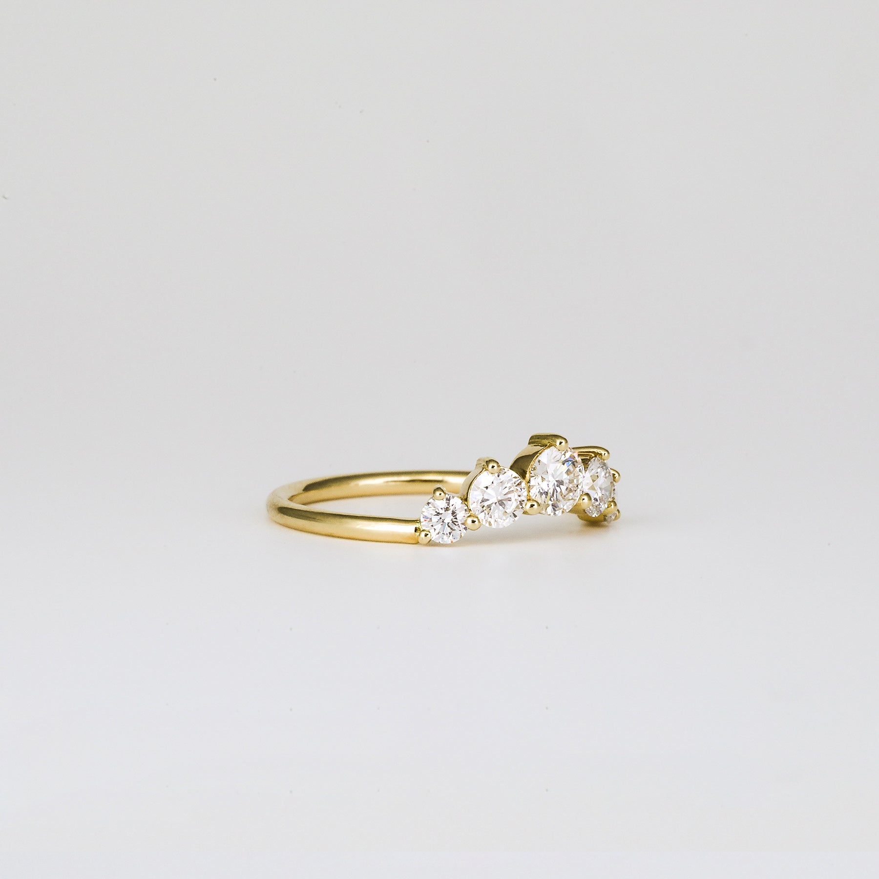 0.72 TCW Round Curved Moissanite Wedding Band