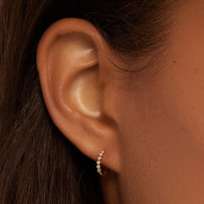 0.098 TCW Round Moissanite Huggies Earrings