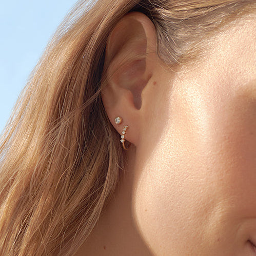 0.125 TCW Round Moissanite Huggies Earrings