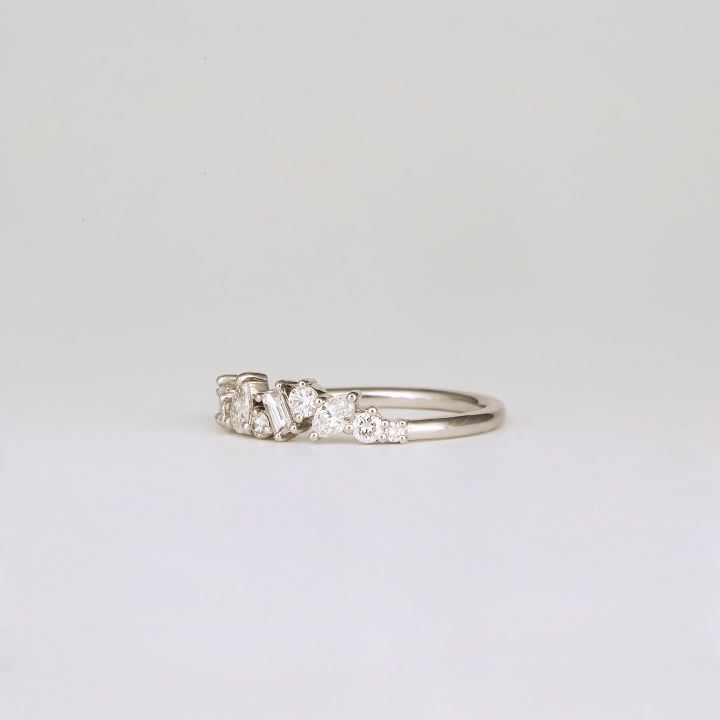 0.57 TCW Baguette, Pear, Round, Marquise & Princess Cluster Moissanite Wedding Band