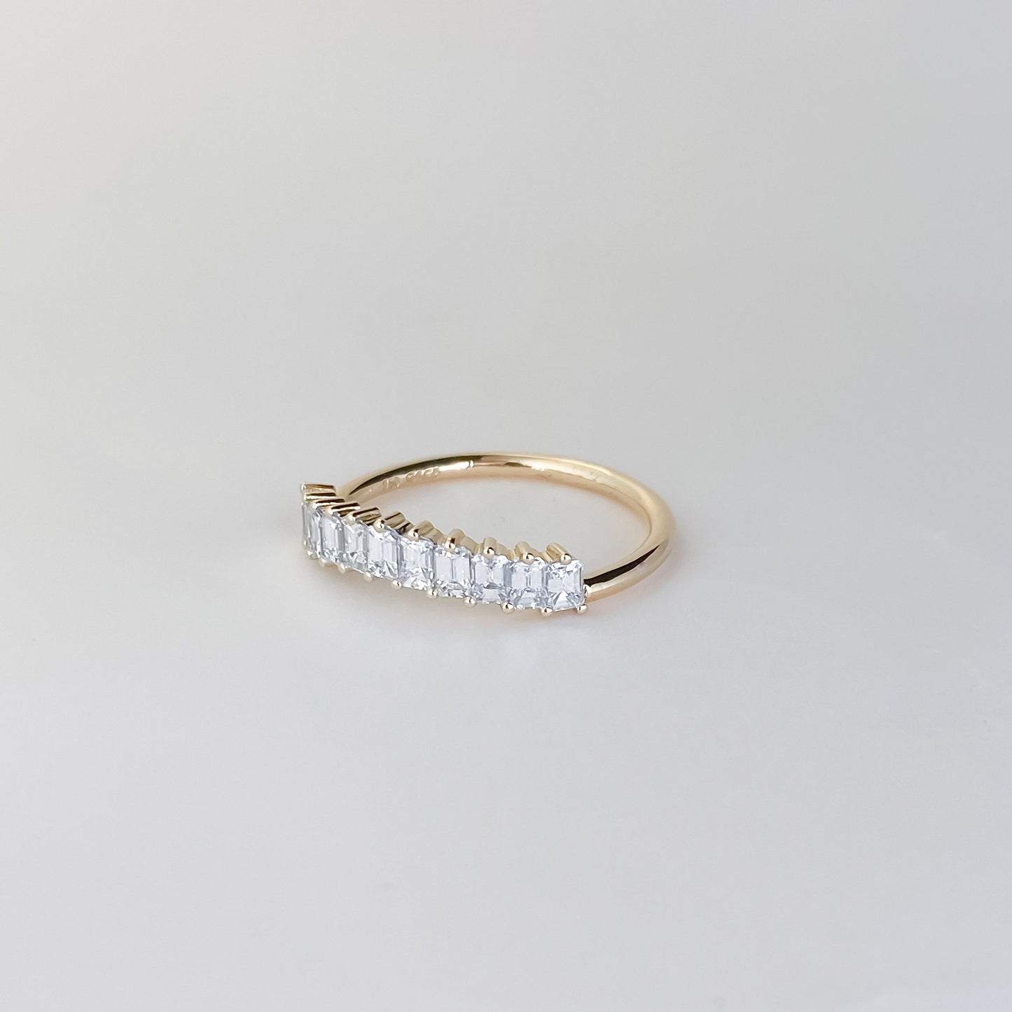 0.68 TCW Emerald Curved Moissanite Wedding Band