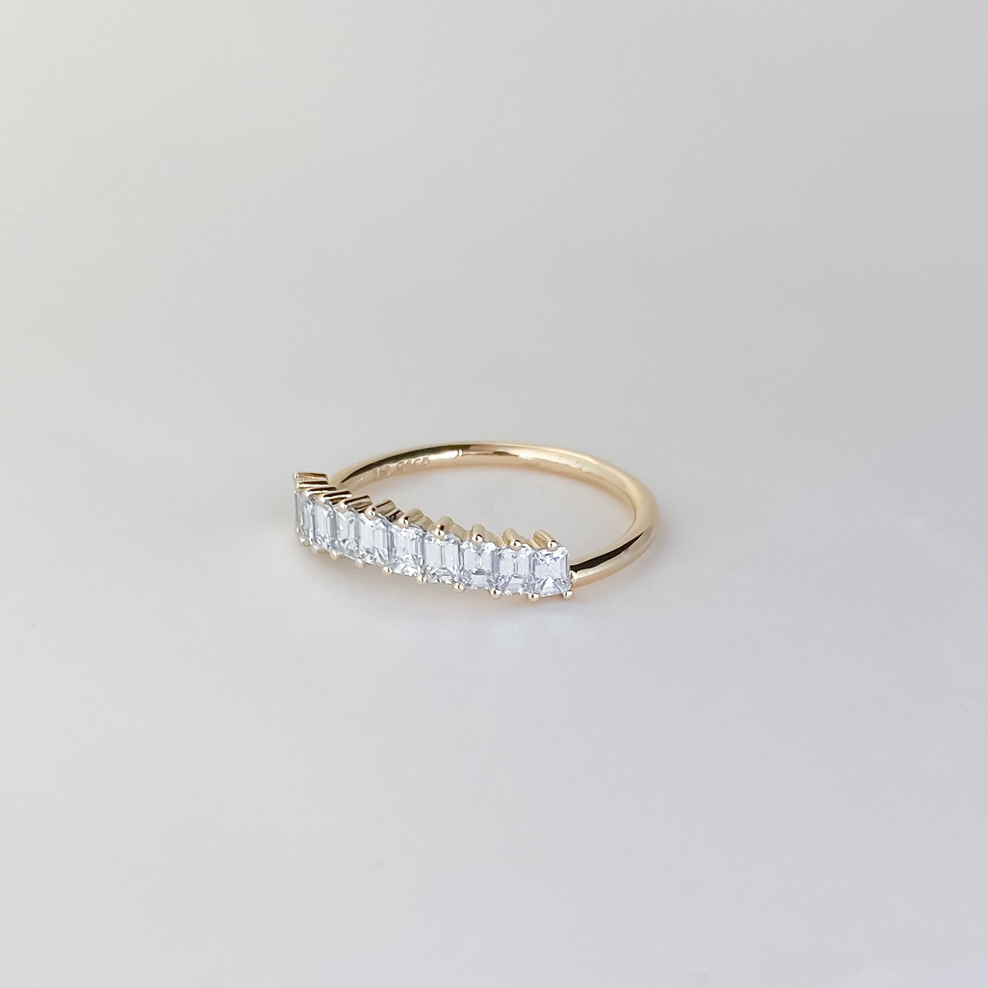 0.68 TCW Emerald Curved Moissanite Wedding Band