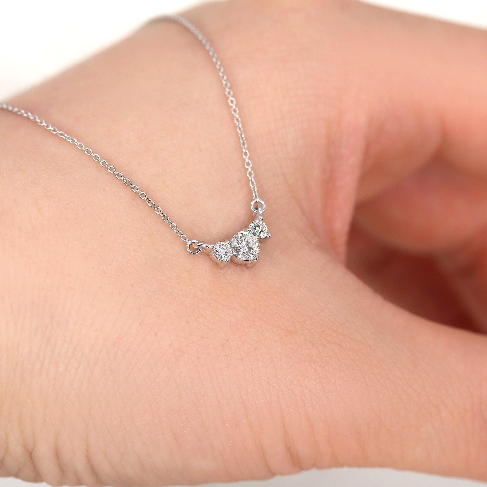 0.2 TCW Round Moissanite Three Stone Necklace