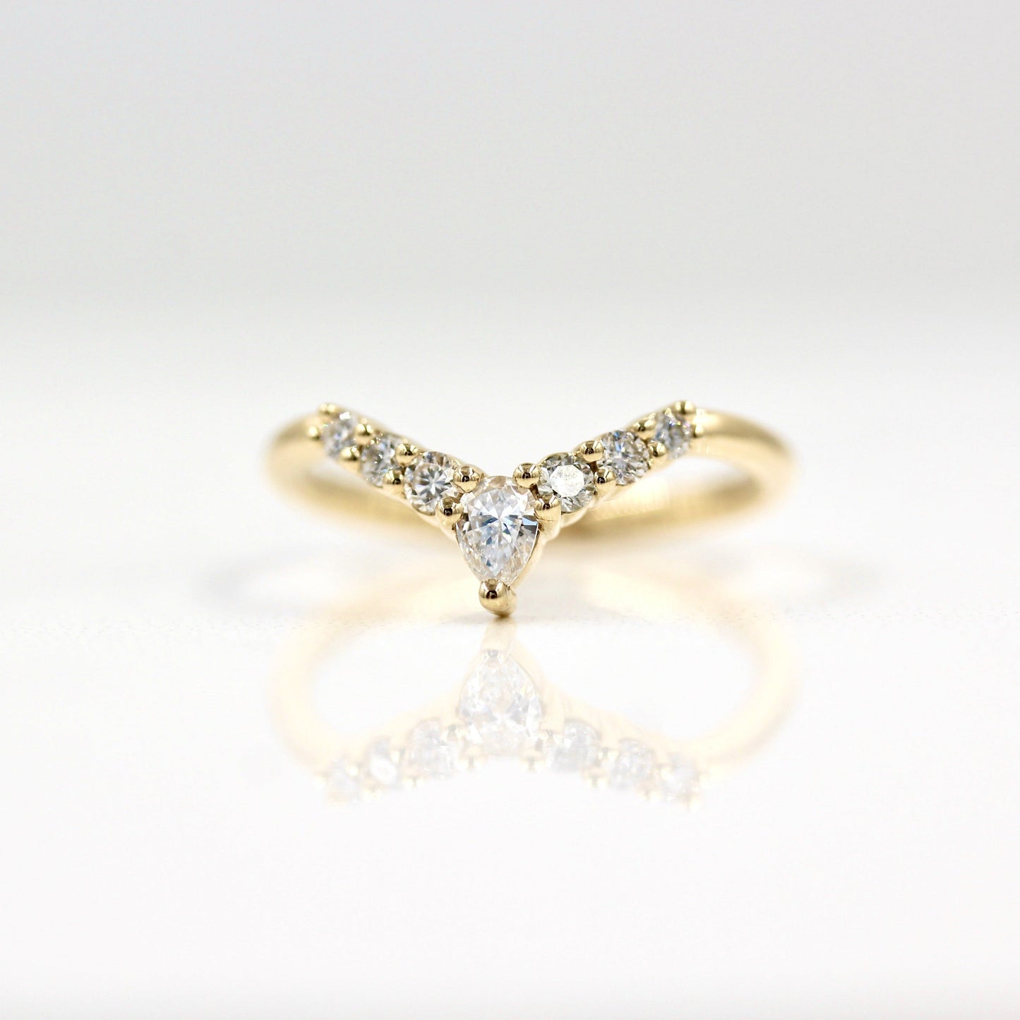 0.31 TCW Round & Pear Curved Moissanite Wedding Band