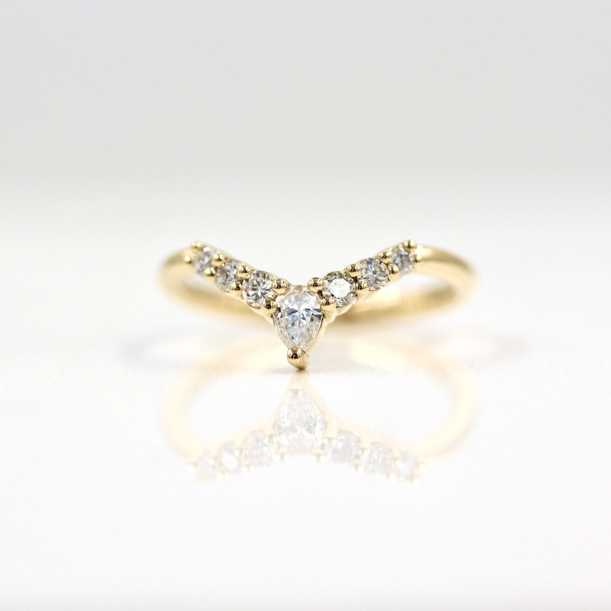 0.31 TCW Round & Pear Curved Moissanite Wedding Band
