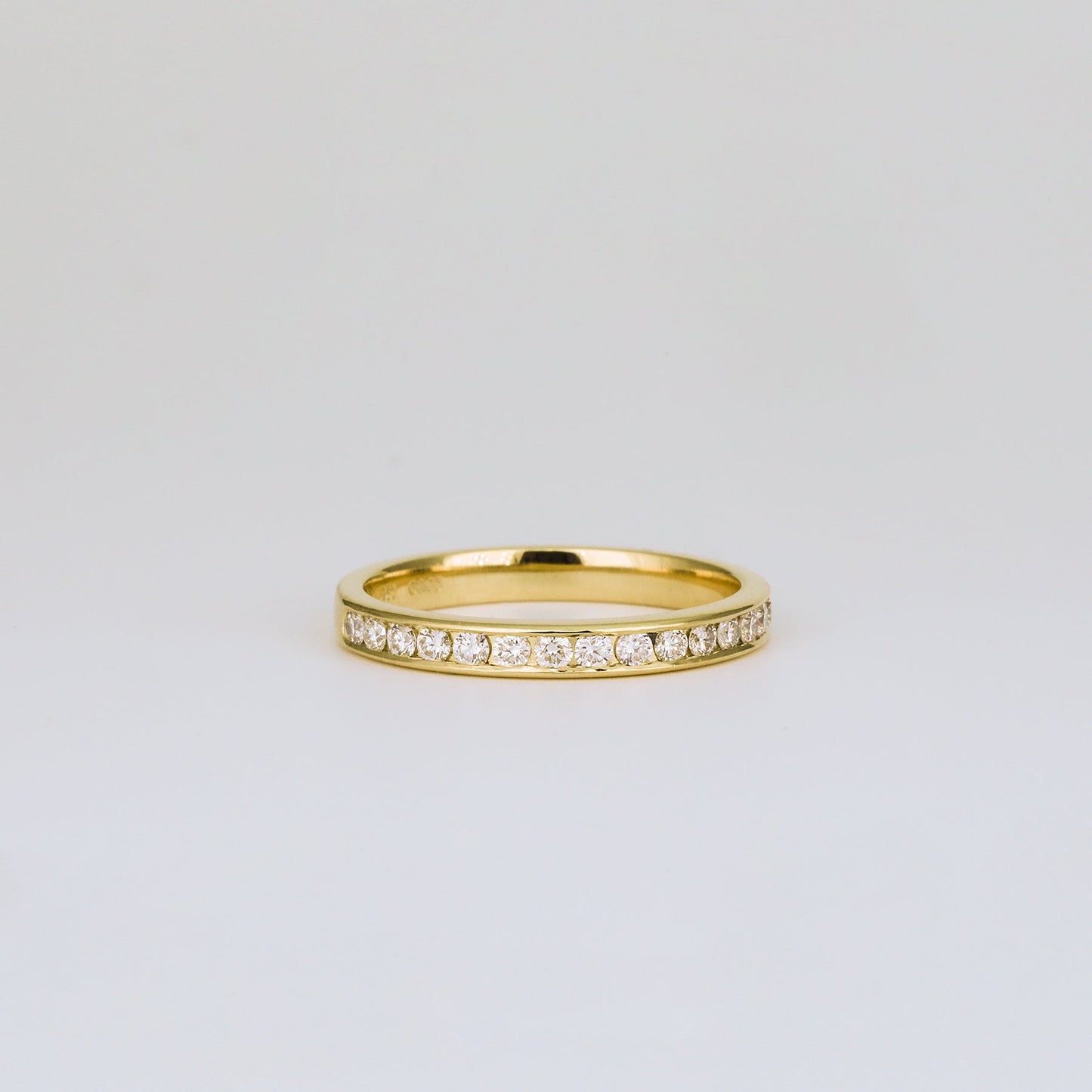 0.32 TCW Round Channel Setting Moissanite Wedding Band