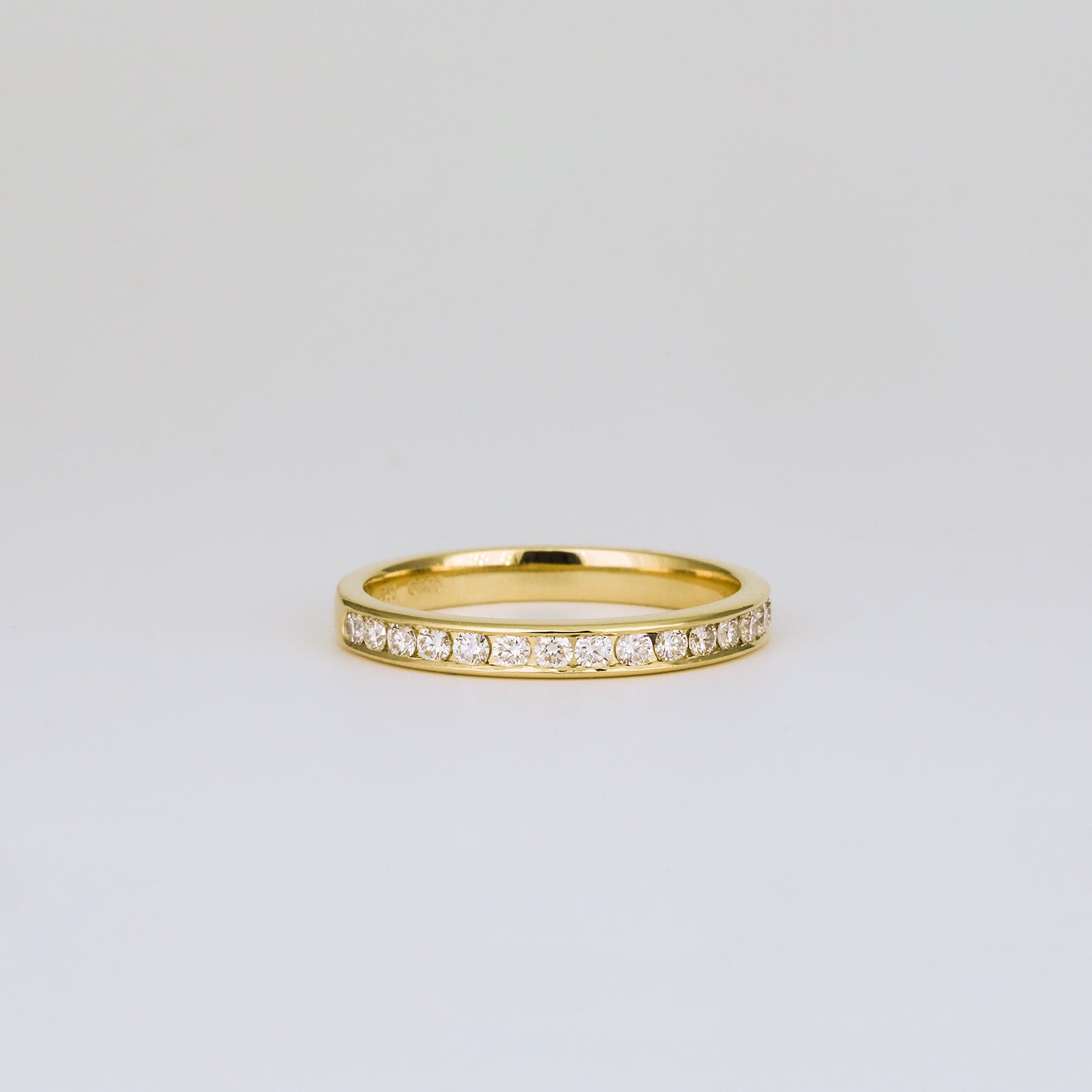 0.32 TCW Round Channel Setting Moissanite Wedding Band