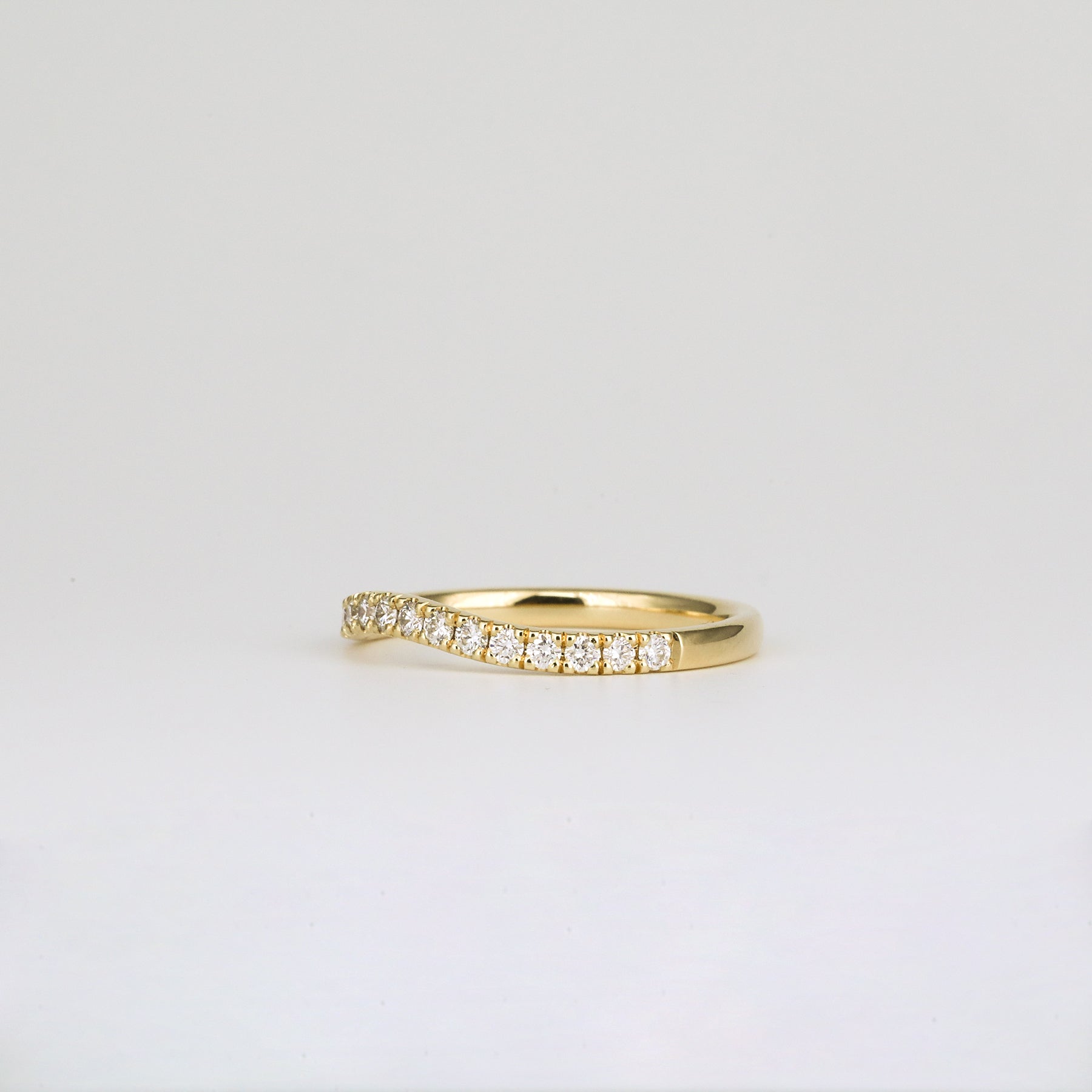 0.33 TCW Round Curved Moissanite Wedding Band