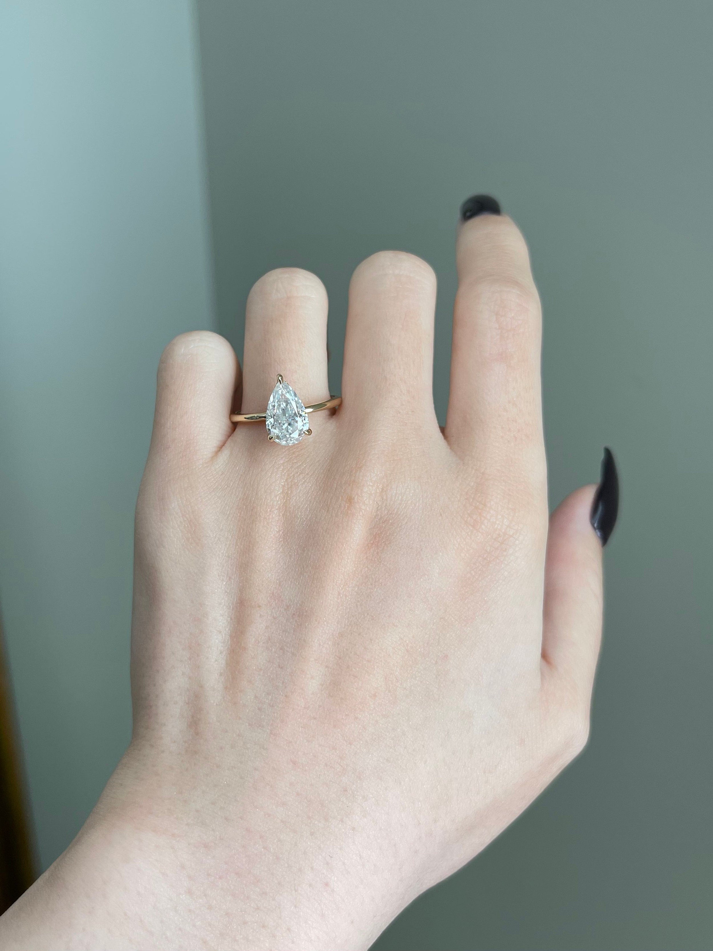 2 CT Pear Shaped Moissanite Engagement Ring In Multiple Stone Design